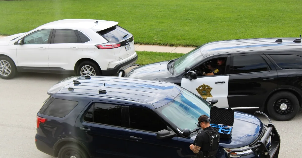 Police lights flash during a pursuit involving agencies from Kansas and Missouri