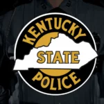 Kentucky State Police vehicle at a crash scene on a roadway in Brandenburg, Kentucky